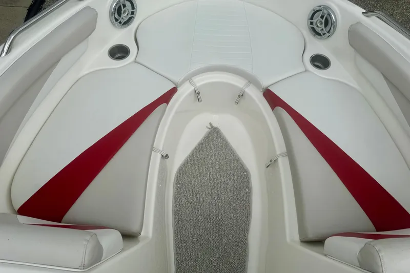 Slide: The Image of Interior of 2008 Glastron GT 225 boat with red and white seating. - 42