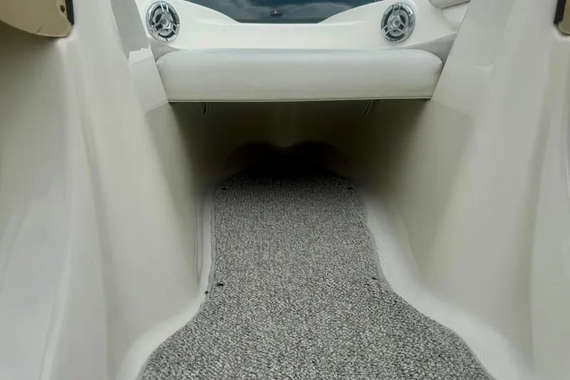 Slide: The Image of Interior view of a 2008 Glastron GT 225 boat with carpeted flooring. - 40