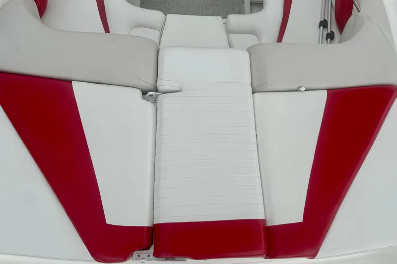 Slide: The Image of Red and white seating on a 2008 Glastron GT 225 boat. - 19