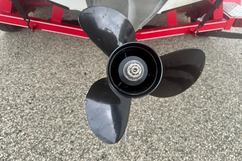 Slide: The Image of Close-up of a 2008 Glastron GT 225 boat propeller on a red trailer. - 8