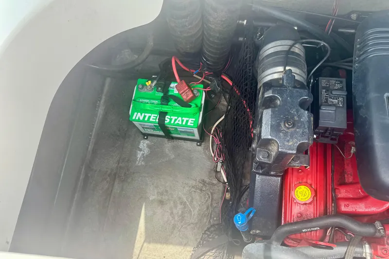 Slide: The Image of Engine compartment of a 2008 Glastron GT 225 with Interstate battery and Volvo Penta components. - 51