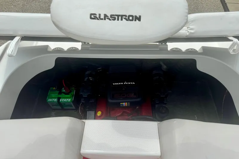 Slide: The Image of 2008 Glastron GT 225 boat engine compartment with Volvo Penta engine and Interstate battery. - 50