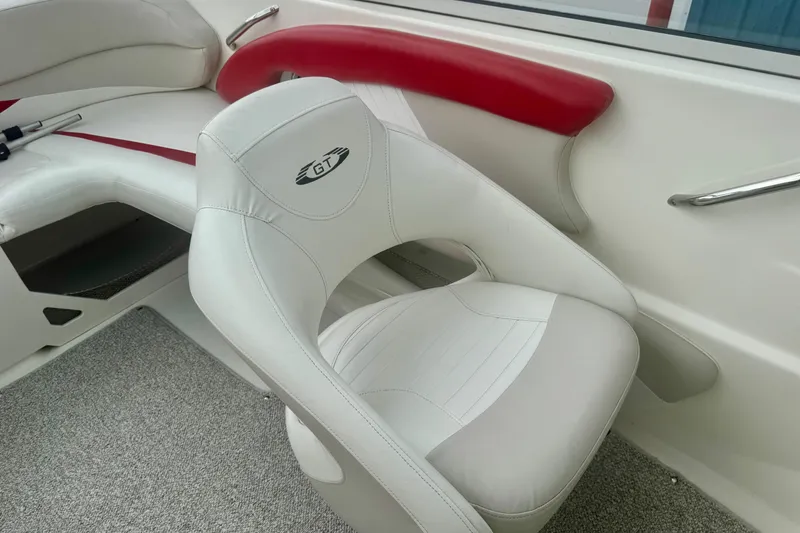 Slide: The Image of 2008 Glastron GT 225 boat interior with white and red seating. - 34