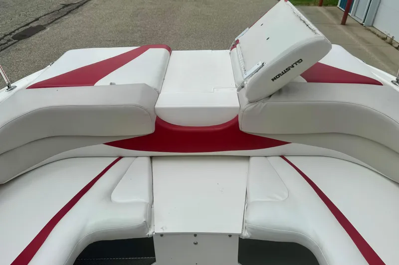 Slide: The Image of 2008 Glastron GT 225 boat interior with white and red seating design. - 48