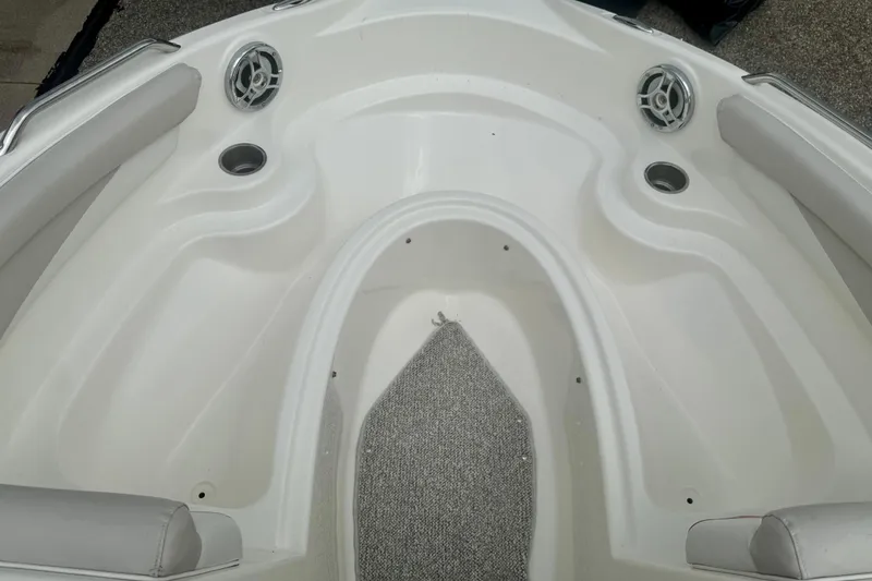 Slide: The Image of 2008 Glastron GT 225 boat interior with speakers and cup holders. - 43