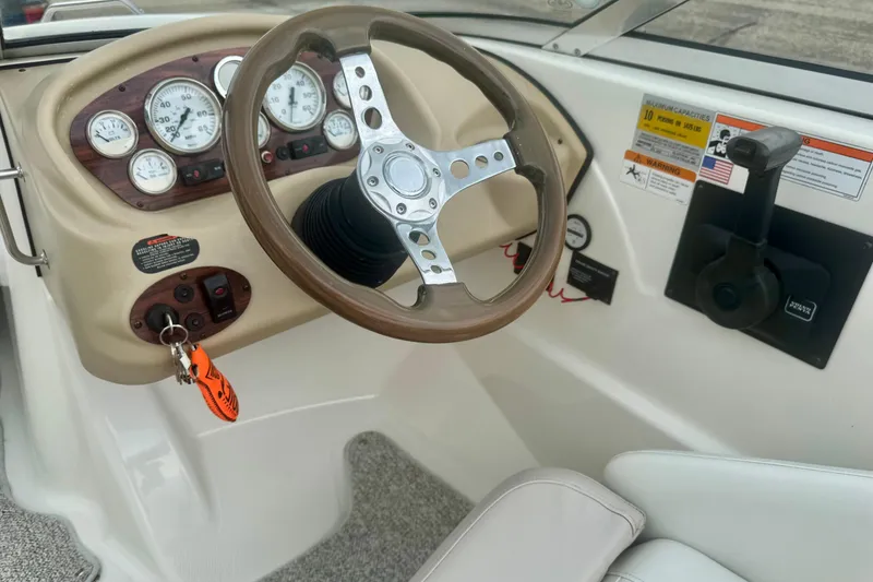 Slide: The Image of 2008 Glastron GT 225 boat dashboard with steering wheel and instrument panel. - 26