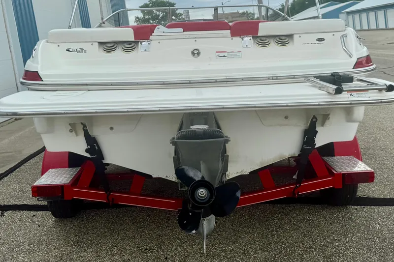 Slide: The Image of Rear view of a 2008 Glastron GT 225 boat on a red trailer. - 7