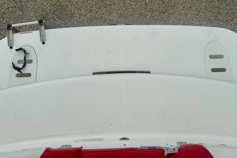 Slide: The Image of 2008 Glastron GT 225 boat swim platform with ladder and red seating. - 18