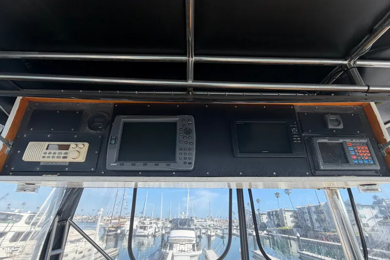 Slide: The Image of Control panel of a 1978 Bertram 46 Convertible yacht with navigation equipment. - 19