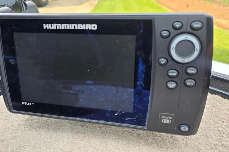 Slide: The Image of Humminbird Helix 7 fish finder on a 2013 Nitro Z-6 boat dashboard. - 13