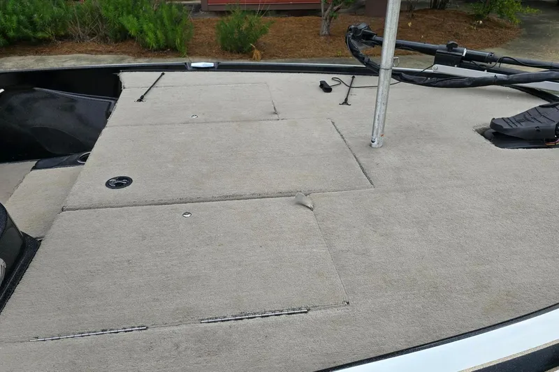 Slide: The Image of 2013 Nitro Z-6 boat deck with carpeted surface and storage compartments. - 10
