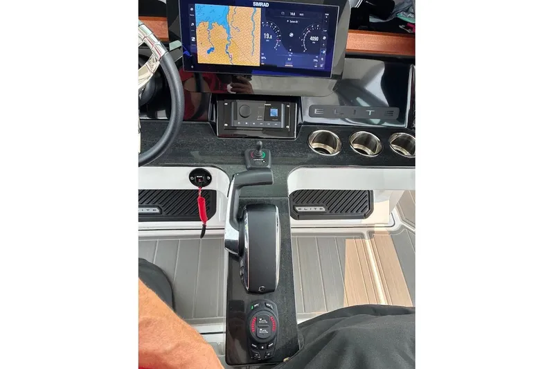 Slide: The Image of 2026 Monterey Elite 25 OB dashboard with navigation display and controls. - 6