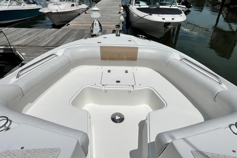 Slide: The Image of 2014 Edgewater 280CX Crossover boat interior at marina dock. - 26