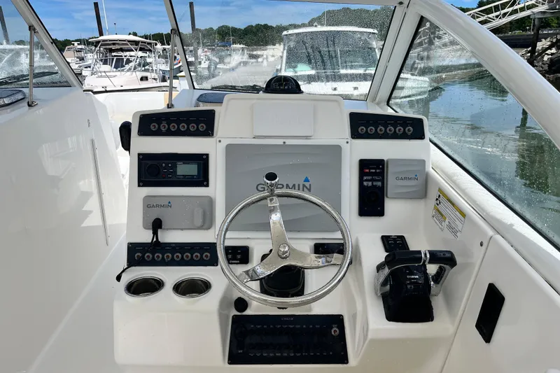 Slide: The Image of Helm of 2014 Edgewater 280CX Crossover boat with Garmin navigation system. - 23
