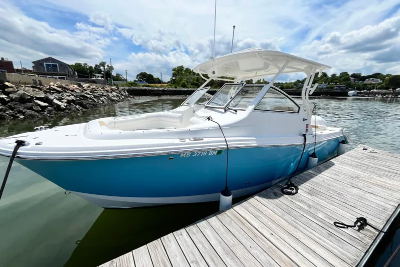Slide: The Image of 2014 Edgewater 280CX Crossover boat docked on a sunny day. - 5