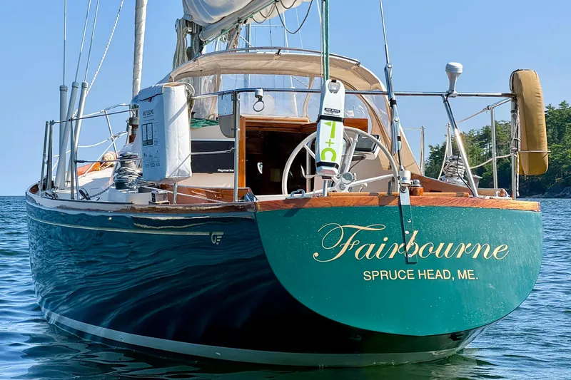Slide: The Image of Classic 1970 Hincley 38 sailboat "Fairbourne" docked in serene waters, Spruce Head, ME. - 8