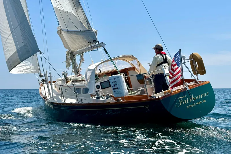 Slide: The Image of Sailing yacht "Fairbourne" on open sea, Hincley 38 model, 1970, with American flag. - 1