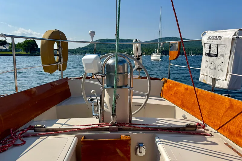 Slide: The Image of Cockpit view of a 1970 Hincley 38 sailboat on a sunny day. - 18