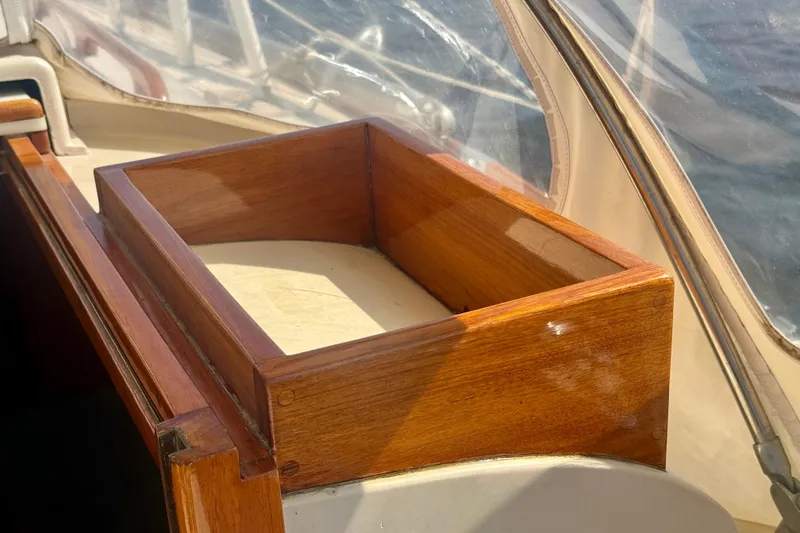 Slide: The Image of Wooden compartment on a 1970 Hincley 38 sailboat, showcasing polished craftsmanship. - 15