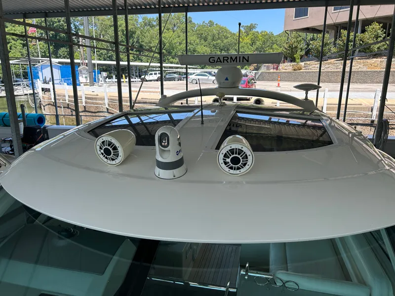 Slide: The Image of The image shows the roof of a 2010 Sea Ray 470 Sundancer with Garmin equipment. - 38