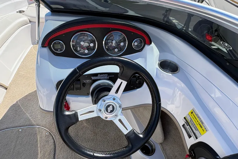 Slide: The Image of Steering wheel and dashboard of 2011 Four Winns H190SS boat. - 10