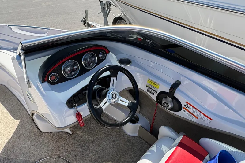 Slide: The Image of Interior view of 2011 Four Winns H190SS boat dashboard and steering wheel. - 11