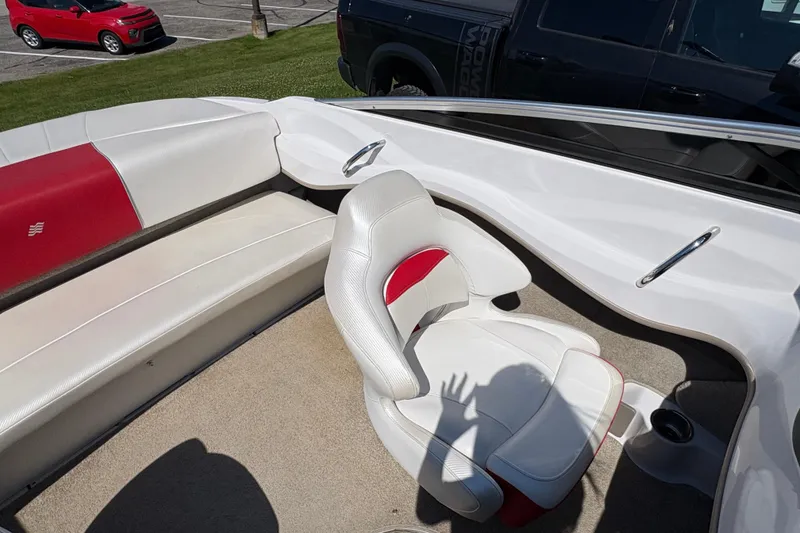 Slide: The Image of Interior of a 2011 Four Winns H190SS boat with white and red seating. - 8