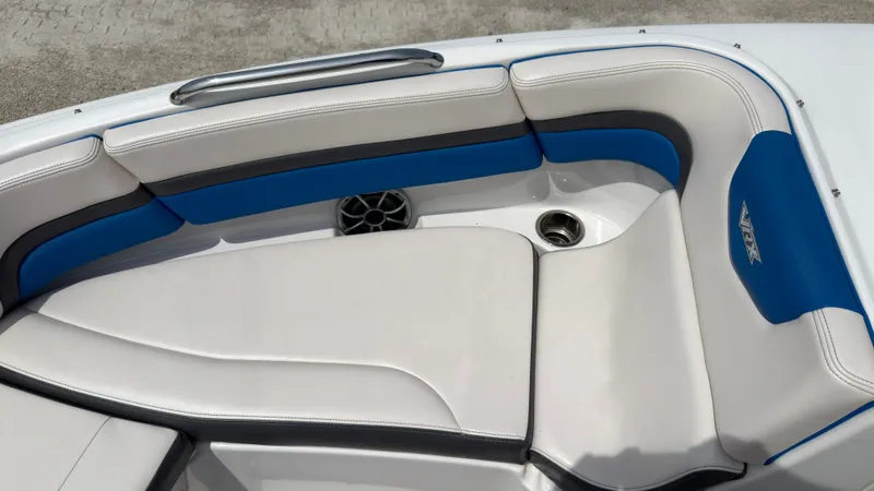 Slide: The Image of The image shows the bow seating area of a 2017 Chaparral Vortex 223 VRX with blue accents. - 34