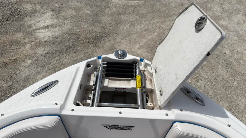 Slide: The Image of An open storage compartment on a 2017 Chaparral Vortex 223 VRX boat. - 36