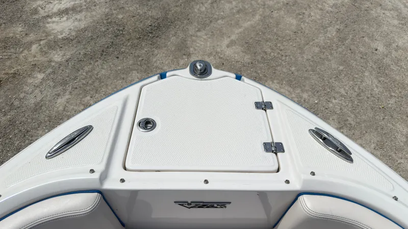 Slide: The Image of The bow of a 2017 Chaparral Vortex 223 VRX with storage compartment and stainless steel fittings. - 35