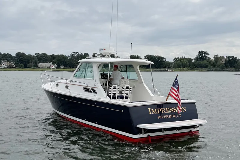 Slide: The Image of 2006 Back Cove 29 boat named "Impression" on water, Riverside, CT. - 1