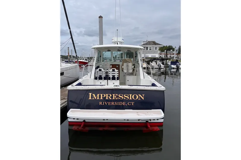 Slide: The Image of 2006 Back Cove 29 boat named "Impression" docked in Riverside, CT marina. - 2
