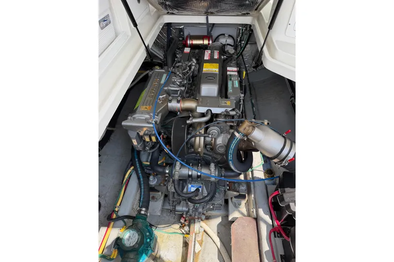 Slide: The Image of Engine compartment of a 2006 Back Cove 29 boat, showcasing detailed mechanical components. - 42
