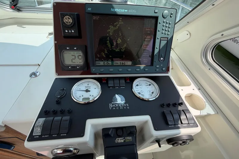 Slide: The Image of Helm of 2006 Back Cove 29 yacht with navigation and control instruments. - 22