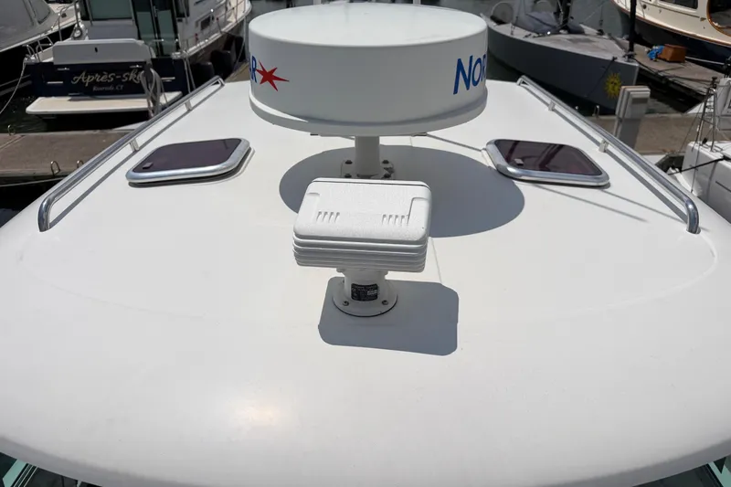 Slide: The Image of 2006 Back Cove 29 boat deck with radar and hatches at marina. - 37