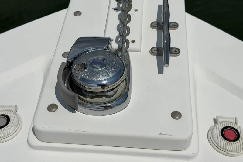 Slide: The Image of Close-up of a 2006 Back Cove 29 boat's anchor windlass and cleat on deck. - 34