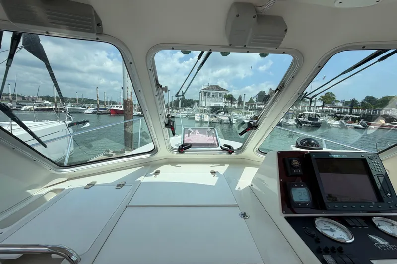 Slide: The Image of Interior view from a 2006 Back Cove 29 boat, overlooking a marina. - 45