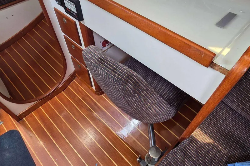 Slide: The Image of Interior of a 1994 J Boats J/130 sailboat with wood flooring and seating. - 47