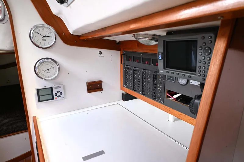 Slide: The Image of Navigation station of 1994 J Boats J/130 with instruments and control panel. - 49