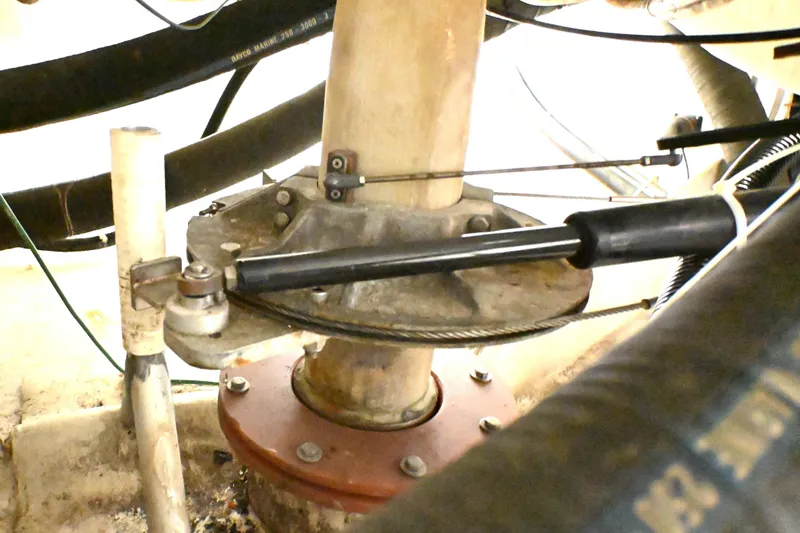 Slide: The Image of Close-up of 1994 J Boats J/130 steering mechanism with cables and hydraulic components. - 55