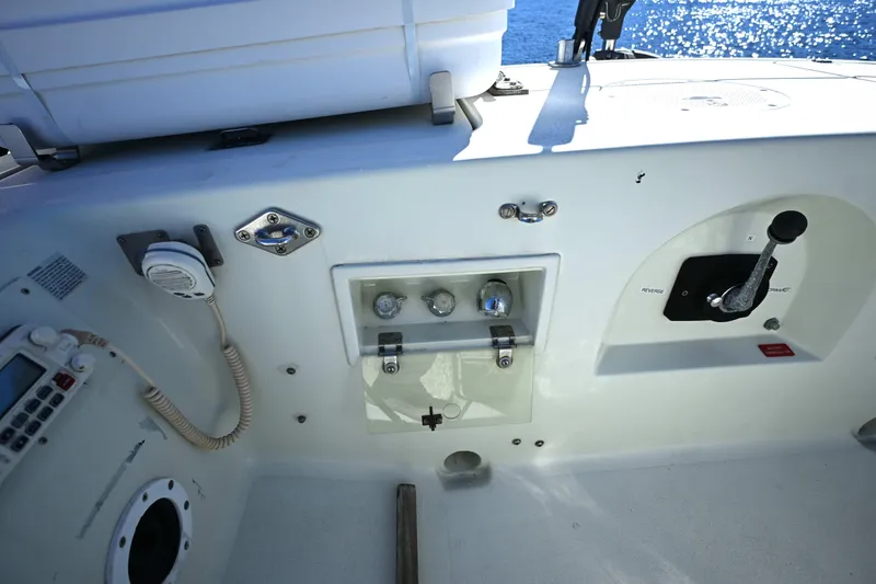 Slide: The Image of Control panel of a 1994 J Boats J/130 sailboat, featuring navigation and communication equipment. - 16