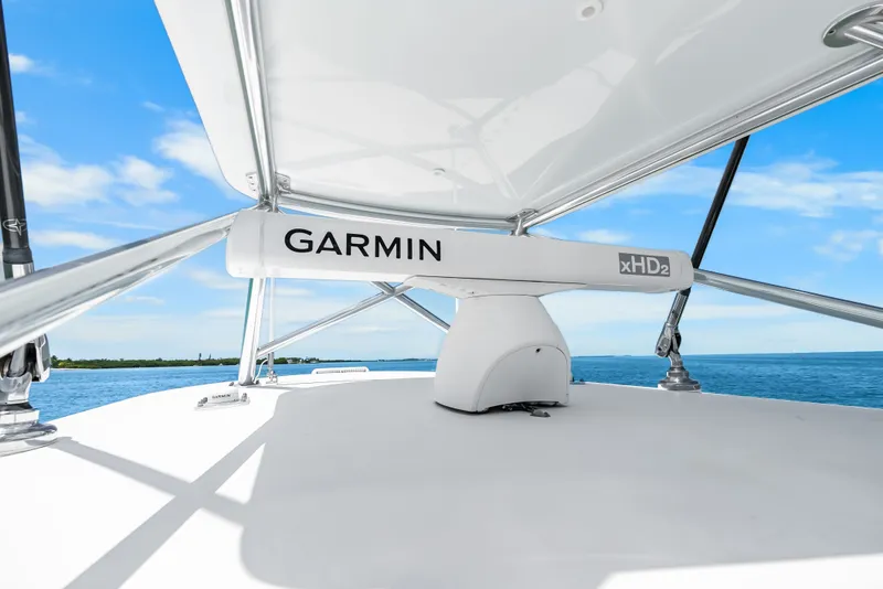 Slide: The Image of The image shows the roof of a Contender 44 ST boat with a Garmin xHD2 radar. - 26
