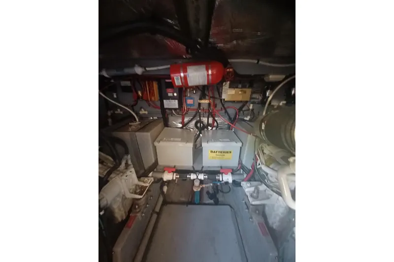Slide: The Image of Engine room of a 1996 Sea Ray 450 Sundancer with visible batteries and wiring. - 30