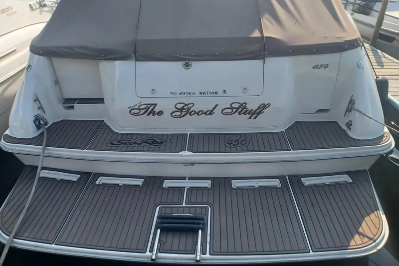 Slide: The Image of 1996 Sea Ray 450 Sundancer yacht with custom name "The Good Stuff" on the stern. - 1