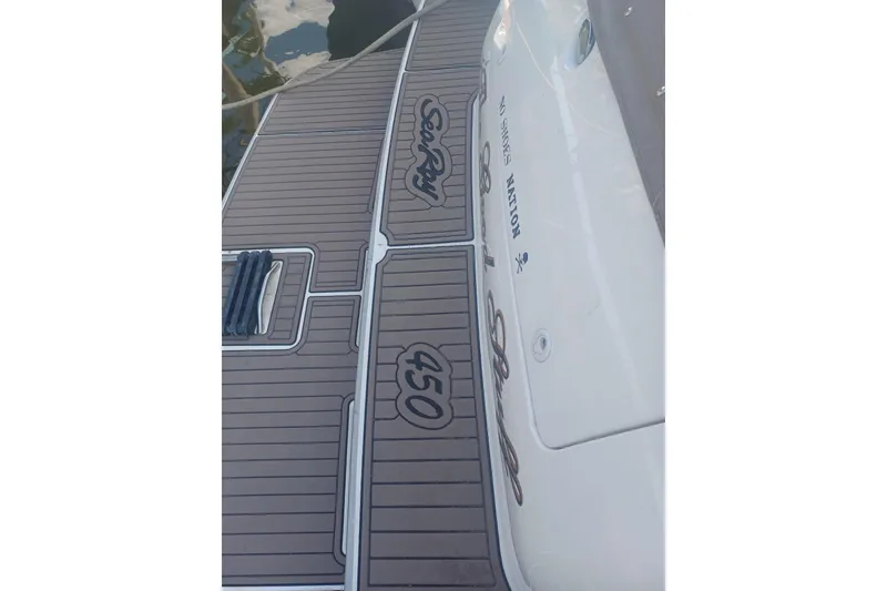 Slide: The Image of 1996 Sea Ray 450 Sundancer boat deck with custom Sea Ray branding. - 2
