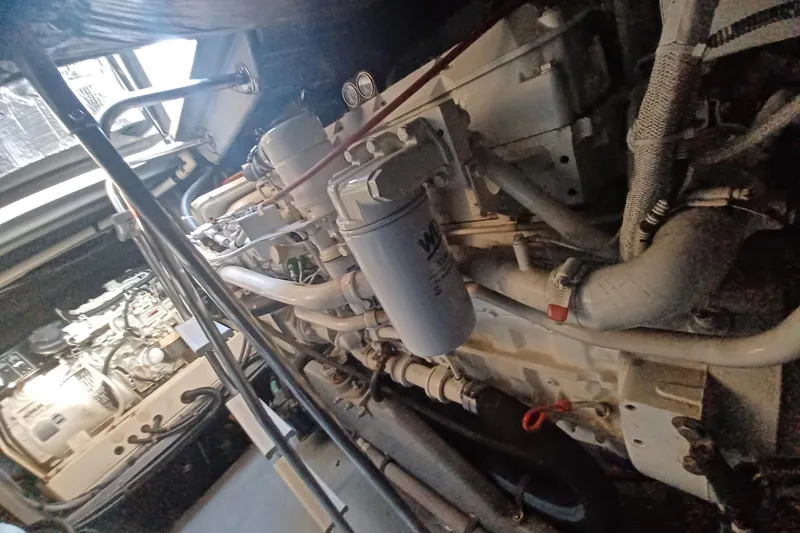 Slide: The Image of Engine room of a 1996 Sea Ray 450 Sundancer, showcasing mechanical components. - 28