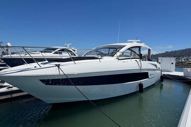 Slide: The Image of 2015 Cruisers 390 yacht docked in marina under clear blue sky. - 20