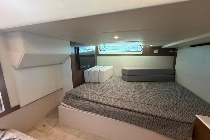 Slide: The Image of Interior cabin of 2015 Cruisers 390 yacht with bed and window. - 14