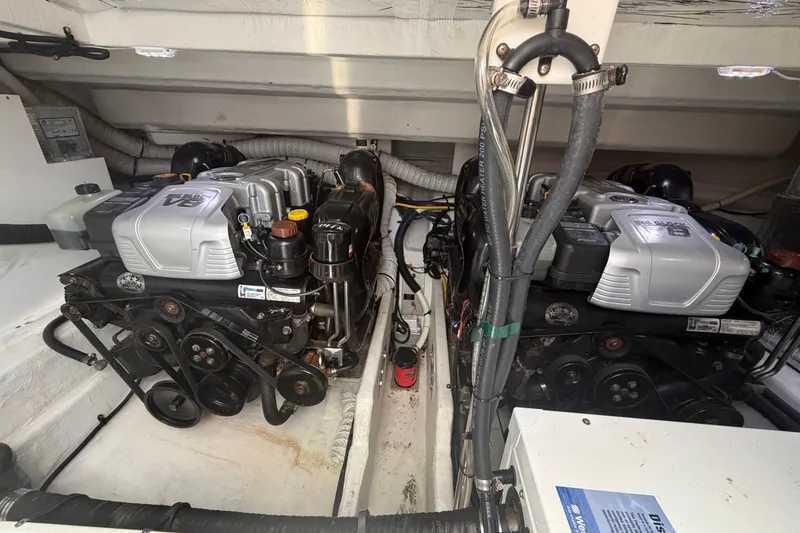 Slide: The Image of Engine compartment of a 2015 Cruisers 390 boat, featuring dual V8 engines. - 18
