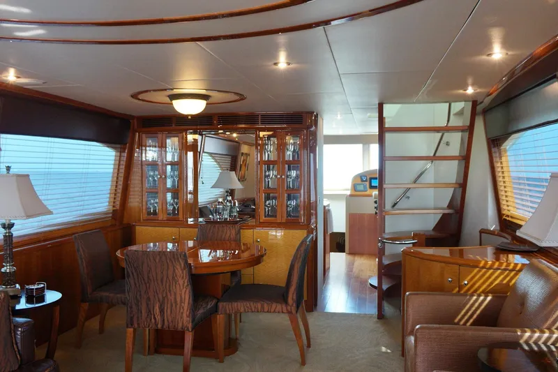Slide: The Image of Luxurious interior of 2007 Lazzara 74 Motoryacht with elegant dining area and wooden finishes. - 14